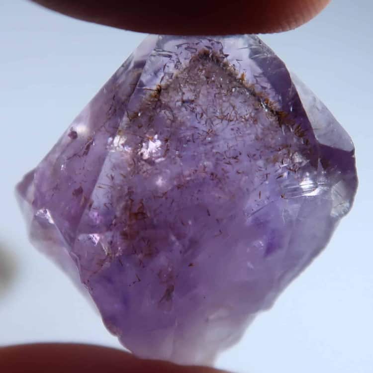 amethyst point with goethite inclusions as a phantom 4